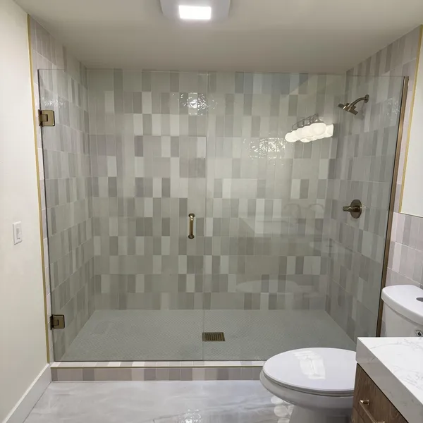 Frameless shower door opening installed for a custom bathroom