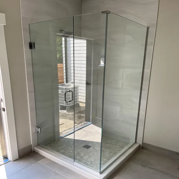 Frameless glass shower enclosure with a clean modern layout