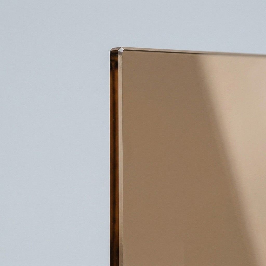 Bronze tinted shower glass panel with warm amber cast