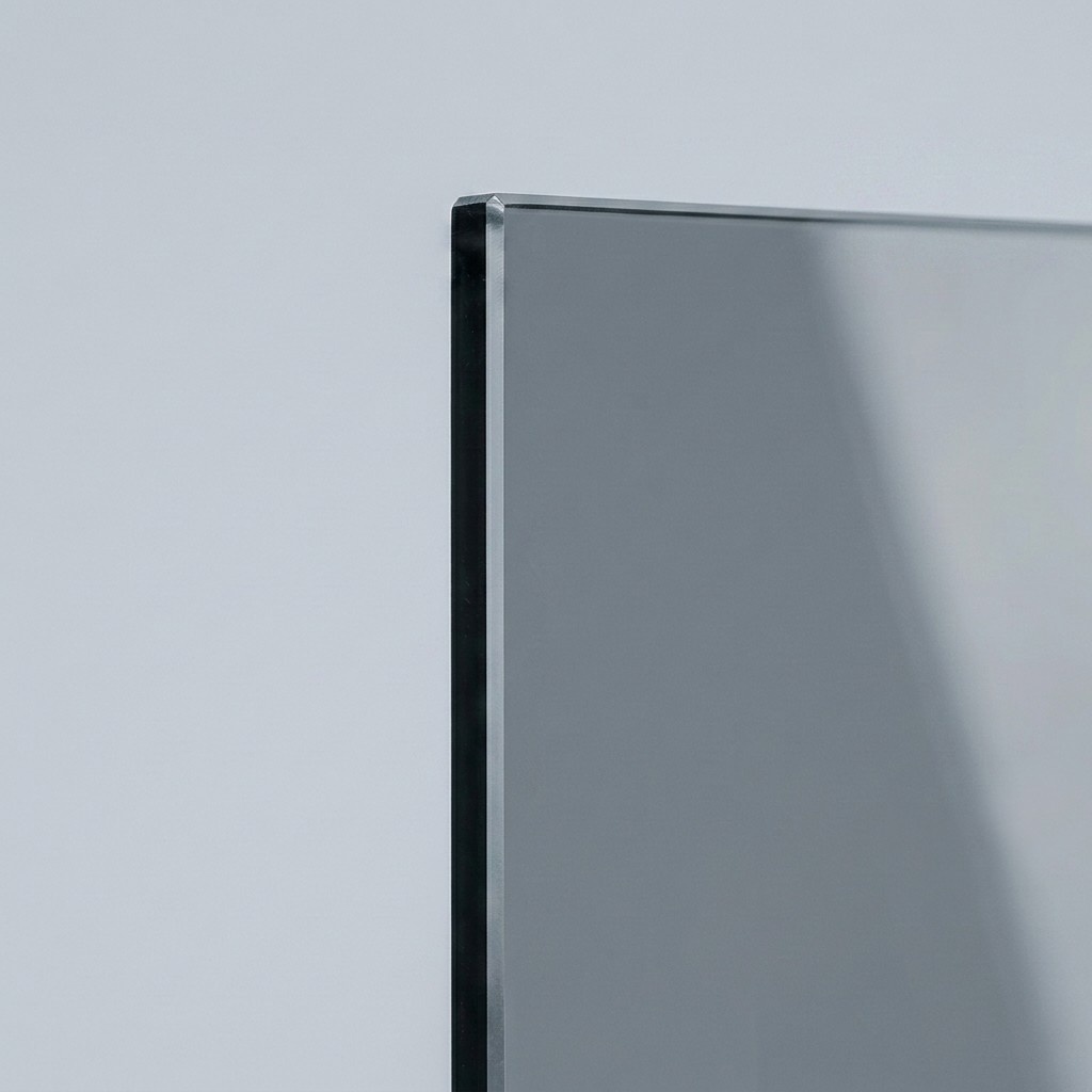 Gray tinted shower glass panel with cool neutral cast