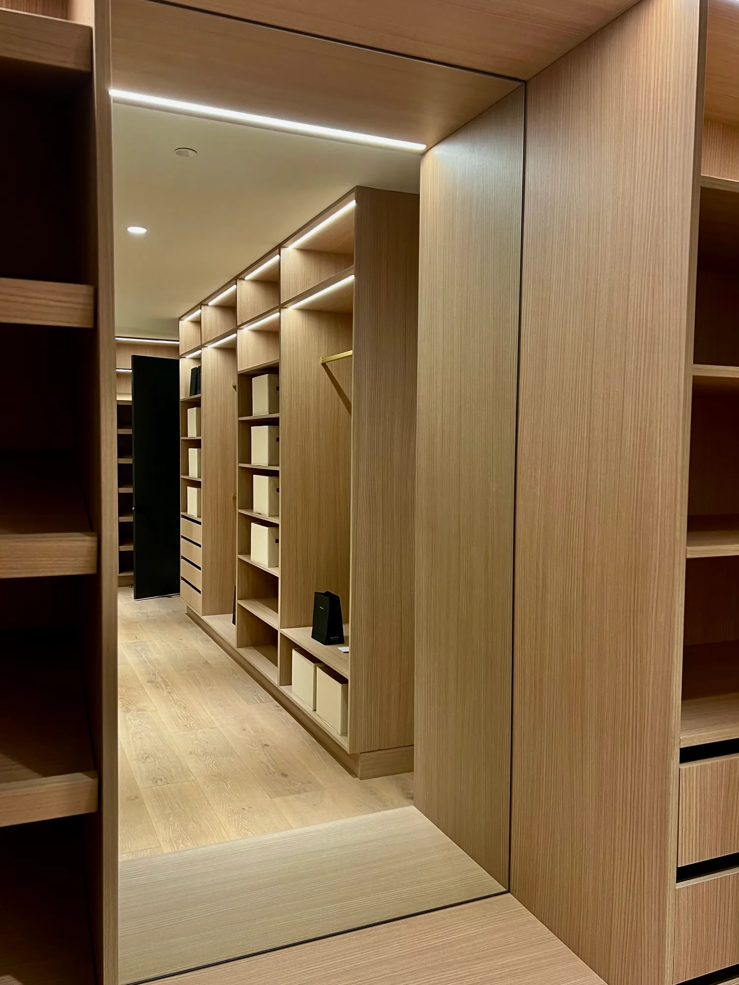 Tall mirror set into walk-in closet cabinetry, installed by IGo Green Enterprises in Clyde Hill, WA
